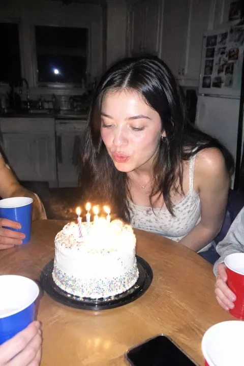 Girl blowing out birthday candles