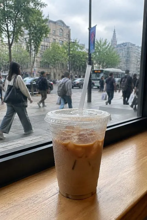 Iced coffee by a café window