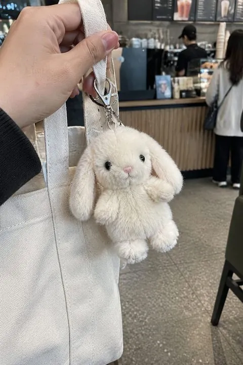Bunny plush keychain on a tote bag